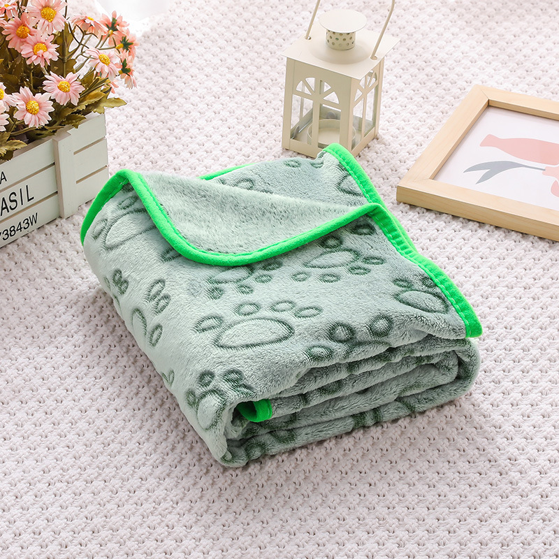 Fleece pet mat with paw and bone pattern