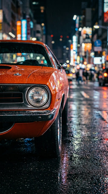 Orange Classic Muscle Car Detail on Wet City Street at Night - Free mobile Wallpaper