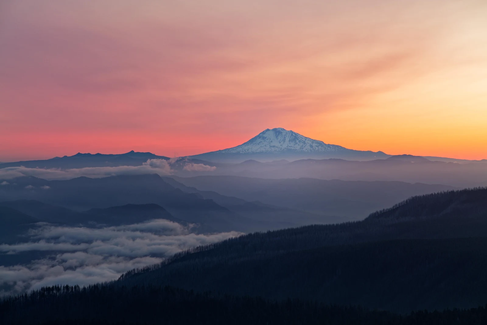 Layered Mountains Under Sunset Sky - Atmospheric Nature Photography 4K Wallpaper (4000x2669)