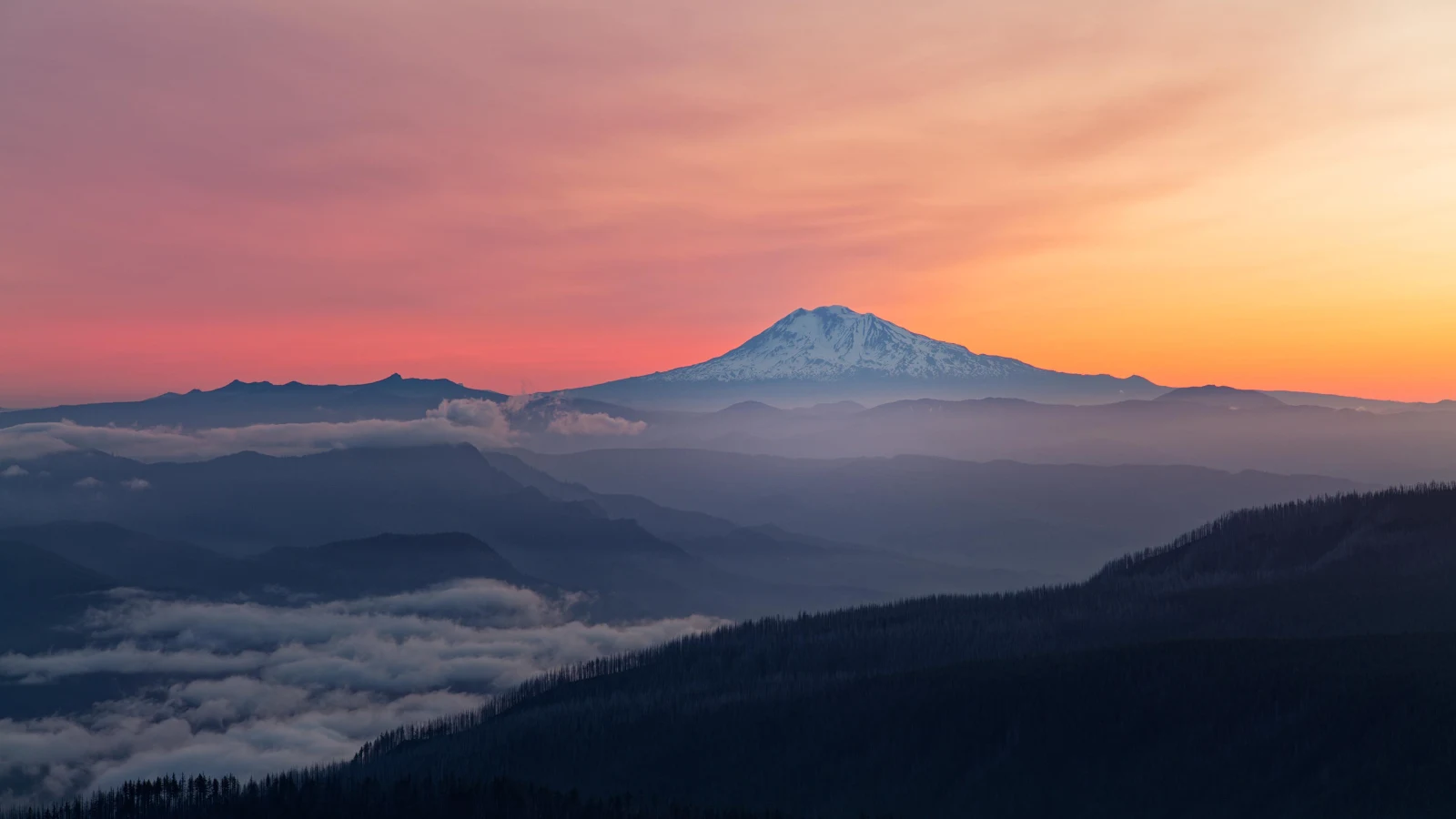 Layered Mountains Under Sunset Sky 4K Desktop Wallpaper