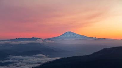 Layered Mountains Under Sunset Sky 4K Desktop & Mobile Wallpaper Background