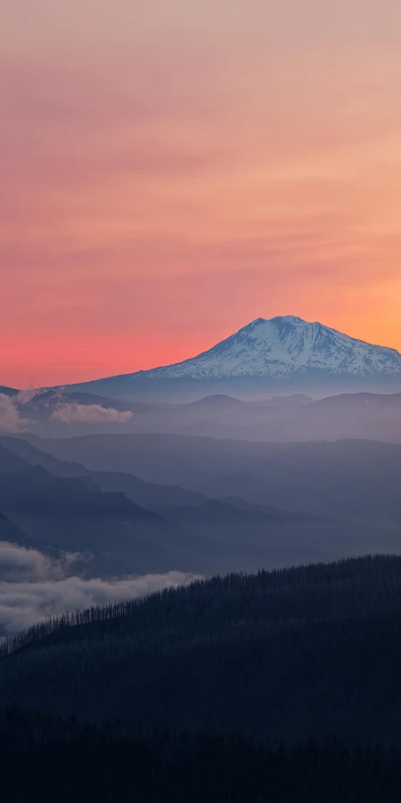 Layered Mountains Under Sunset Sky 4K Phone Wallpaper