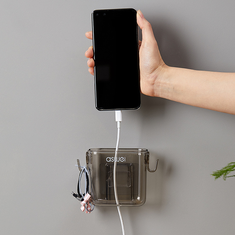 Wall-mounted storage box for remote controls and mobile phones