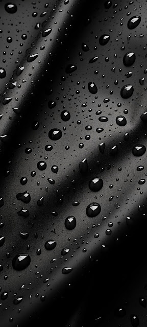 Reflective Water Droplets on Dark Black Textured Surface - Free mobile Wallpaper