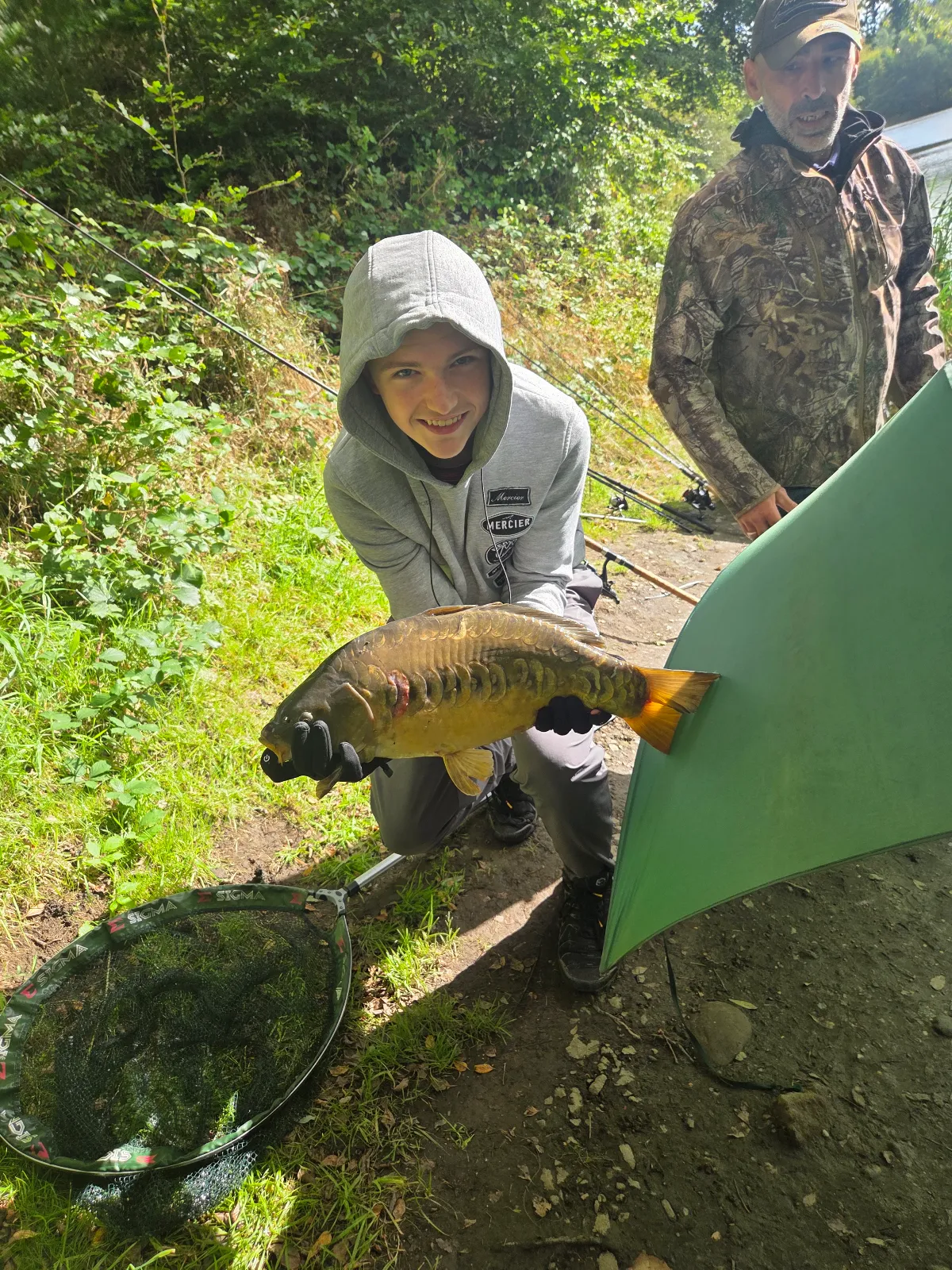 Leon Menzies with a Carp from Magiscroft Fishery