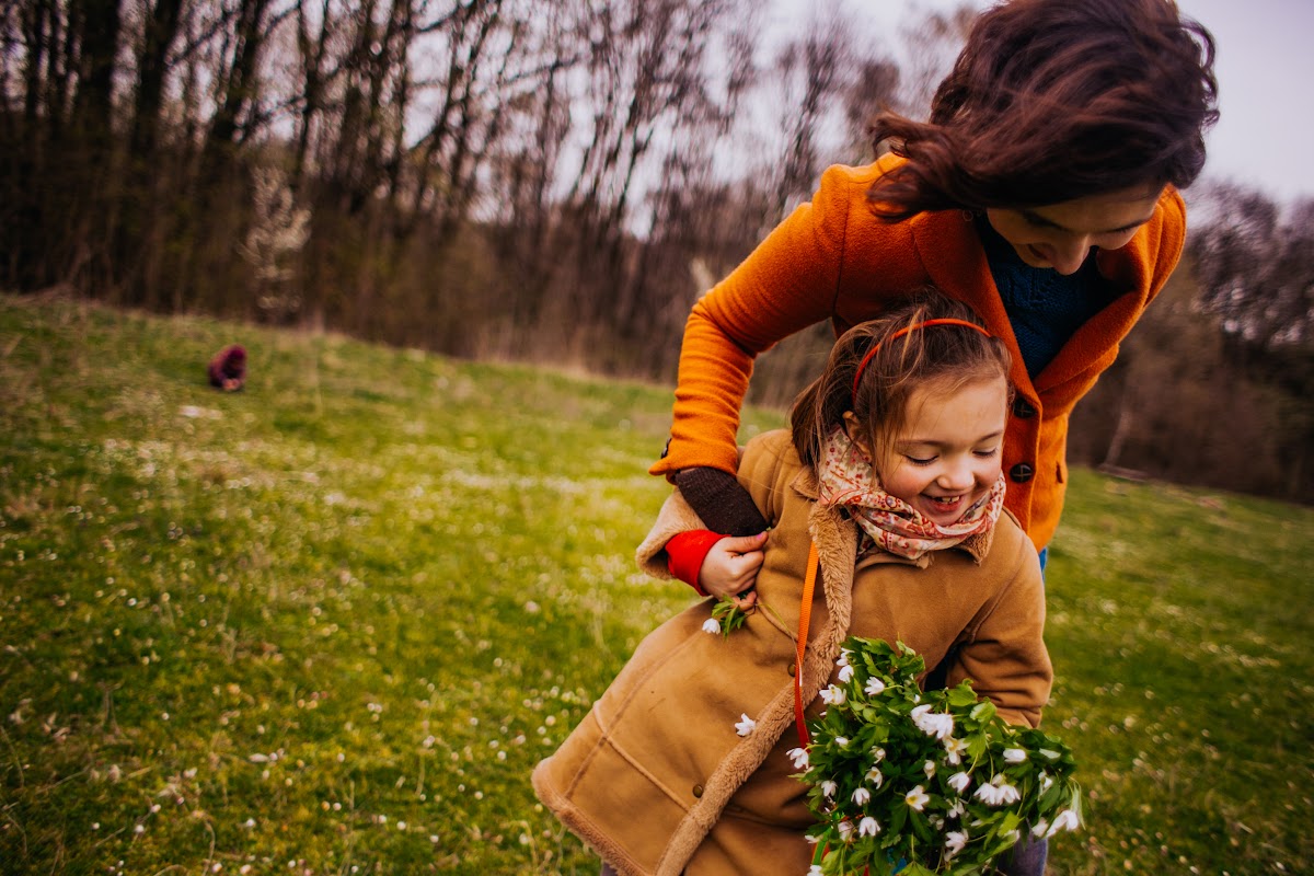 Mother and daughter walking in park