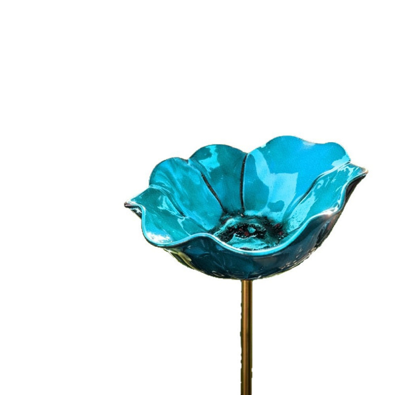 Decorative metal bird feeder in flower shape