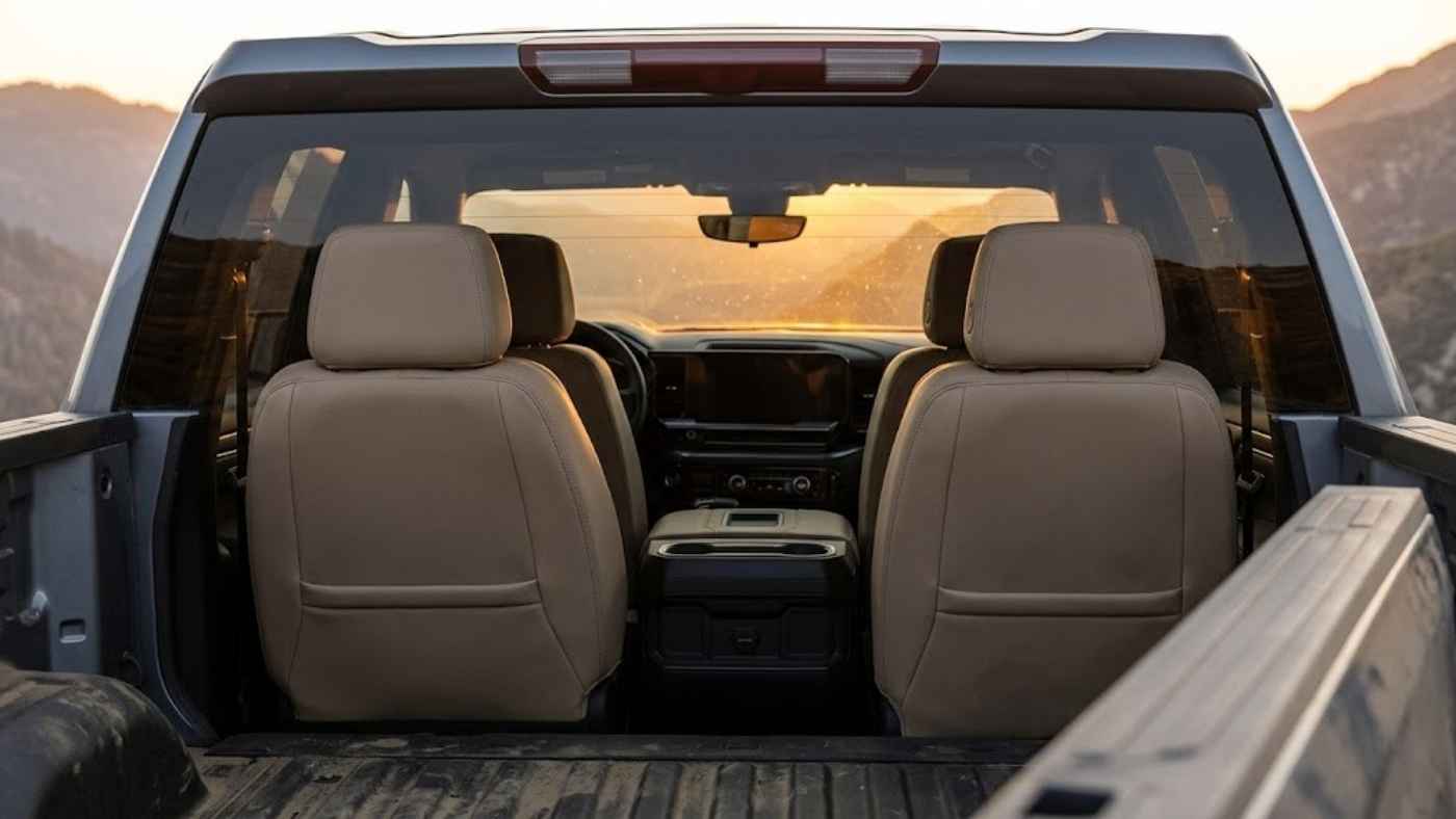 Eco-leather seat cover installed over the front seats of a 2027 GMC Sierra 1500 SLE