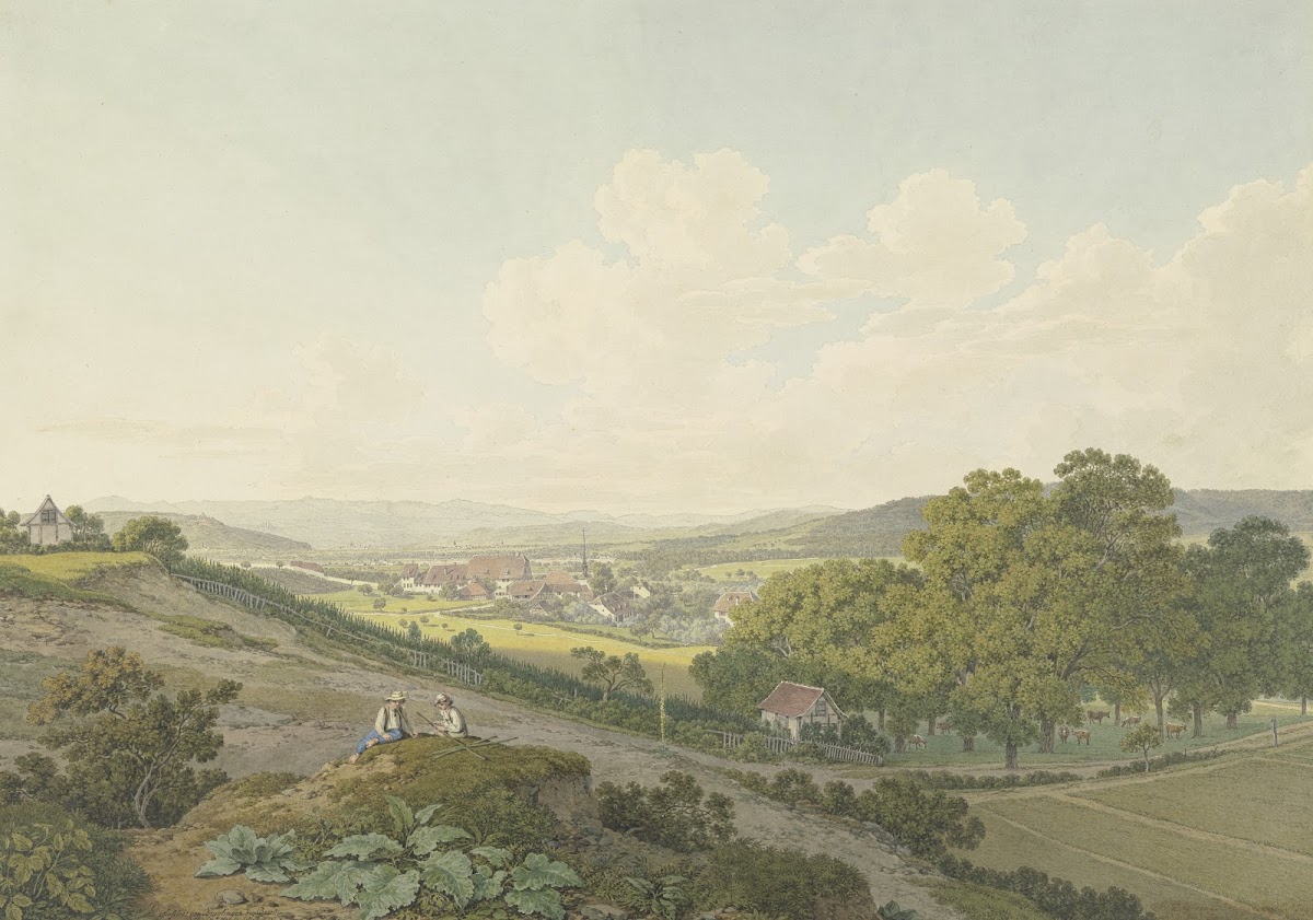Blick von einer Anhöhe auf das Dorf St Jakob bei Basel mit spitzem Kirchturm 180