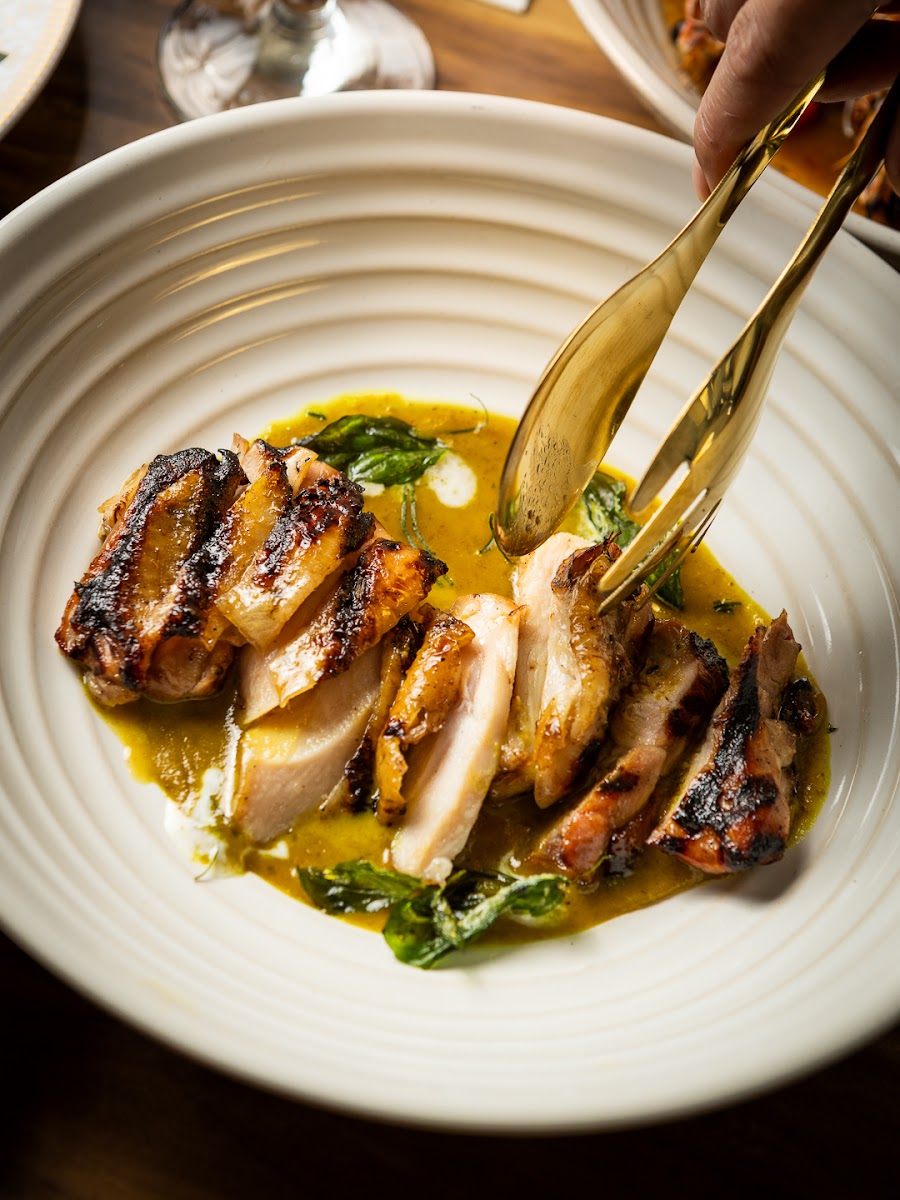 Kai Yang Keow Wan — charcoal-grilled chicken with green curry reduction