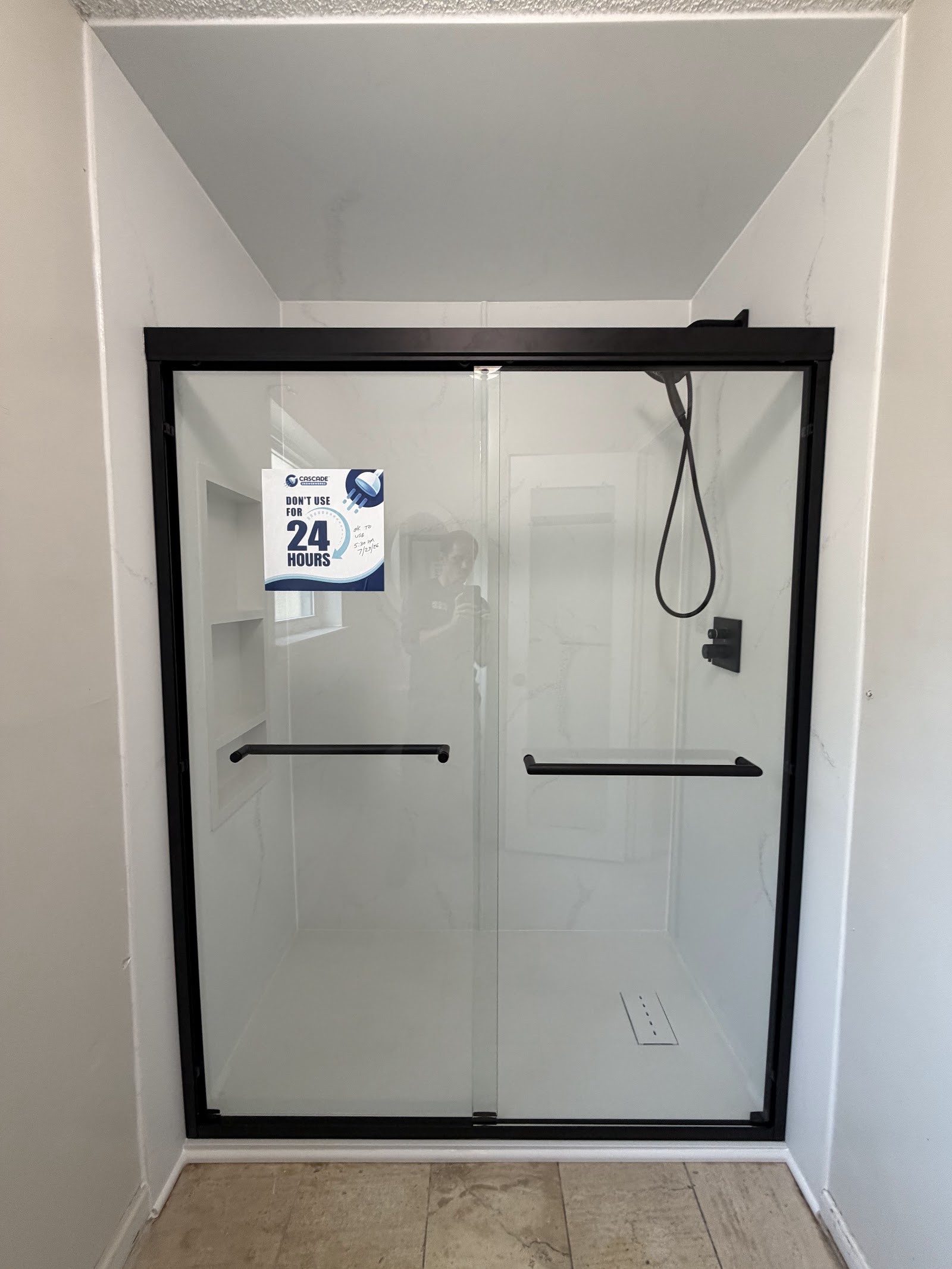 After tub to shower conversion — cast-acrylic walk-in shower installed by Cascade Showerworks