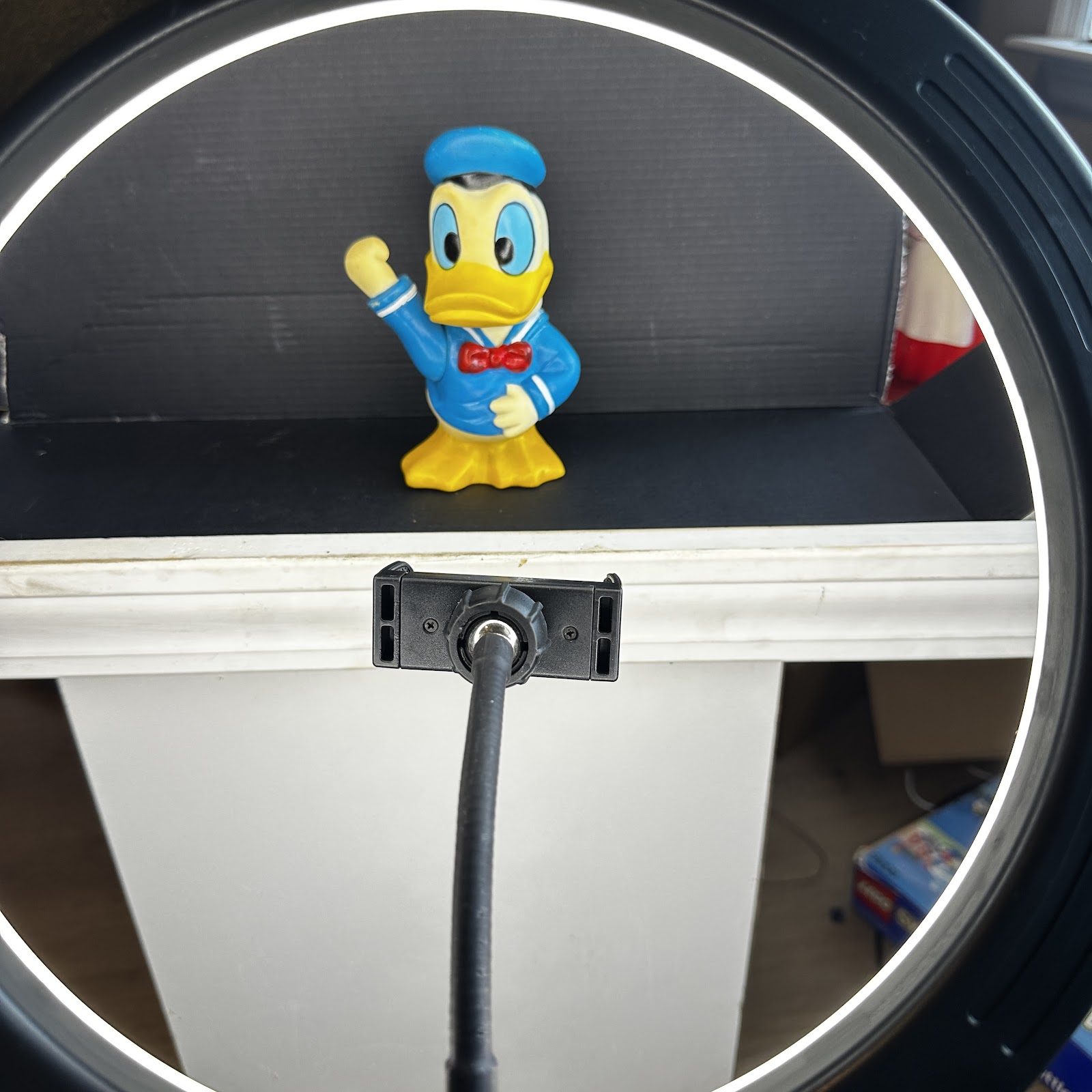 Vintage 1970s soft vinyl Donald Duck squeak toy figure, waving pose, blue sailor suit with red bow tie, approximately 8-10 inches tall