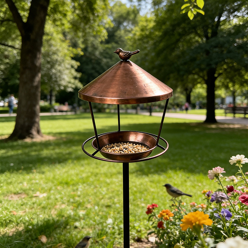 Bird feeding station with iron ground stake