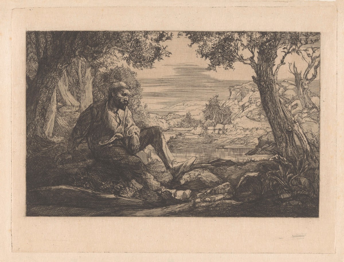 Zittende man in heuvellandschap