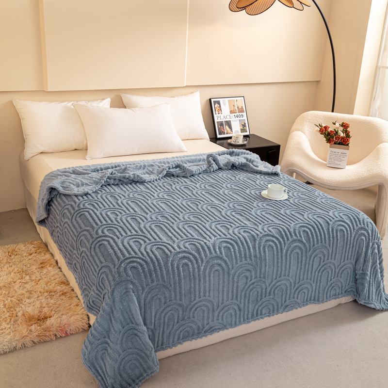 Padded throw blanket with jacquard pattern