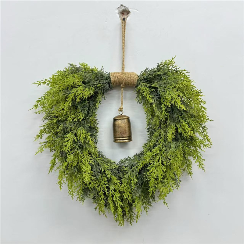 Heart-shaped Christmas wreath with bells