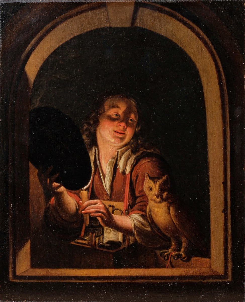 A young boy with a owl