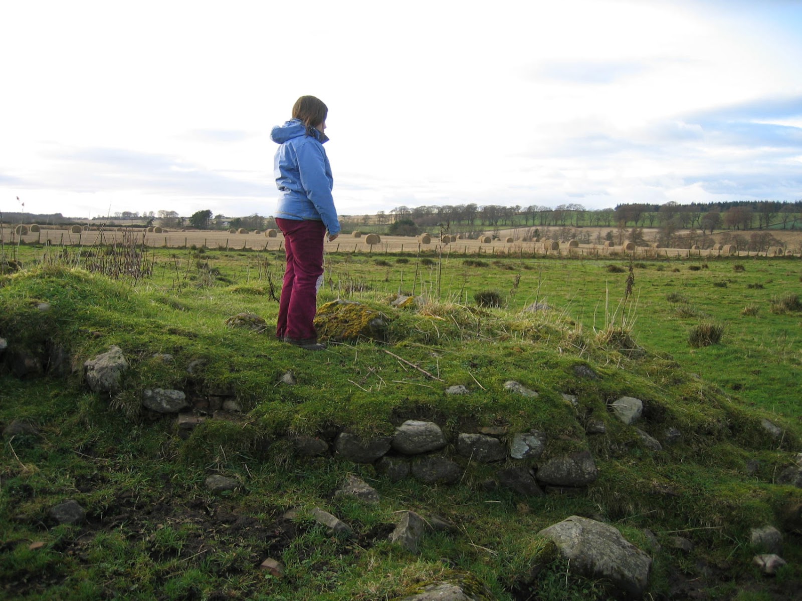 StMartinsStory_Kirsty_stands_on_remains_of_StMartins_Church_IMG_0086.jpg
