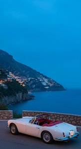 Classic White Convertible Sports Car on a Coastal Road at Twilight with Cliffside Lights