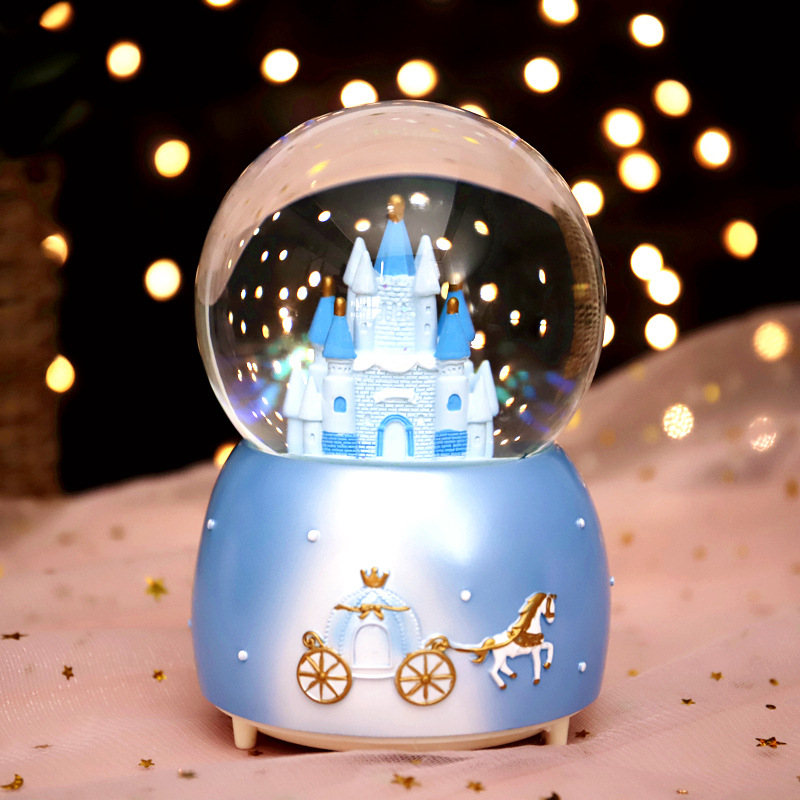Enchanting snow globe with music and light