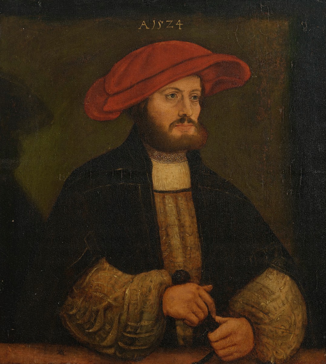 Portrait of a gentleman in a red cap before a ledge 1524