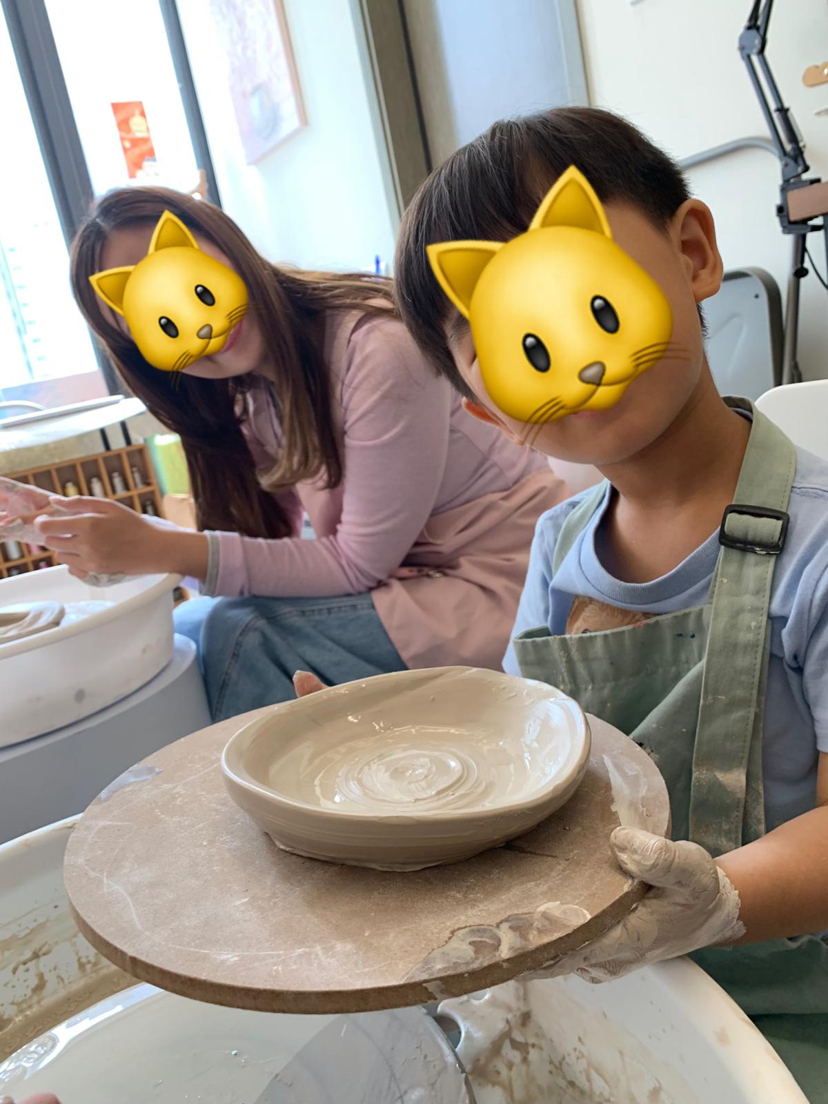 Parent-child pottery workshop in action.