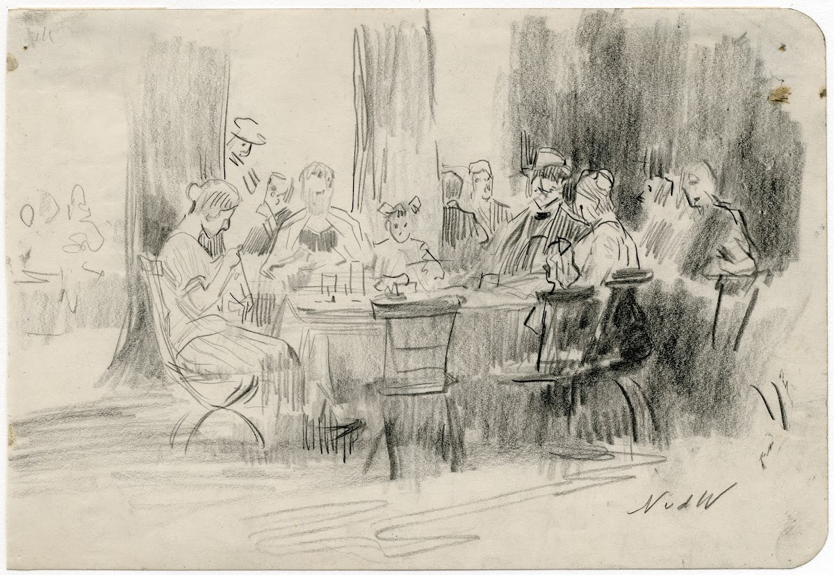 Hotelgasten rond een tafel
