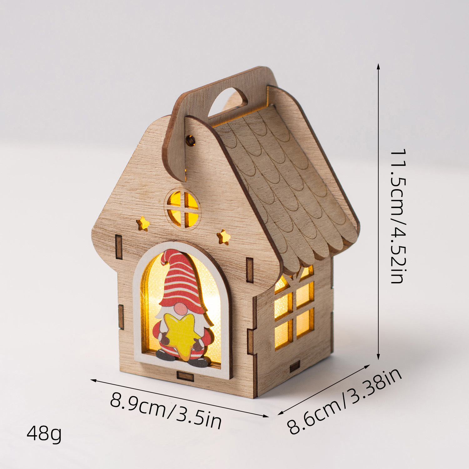 Illuminated wooden house as Christmas decoration