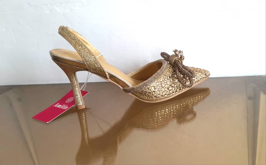Gold-colored high-heeled sandals