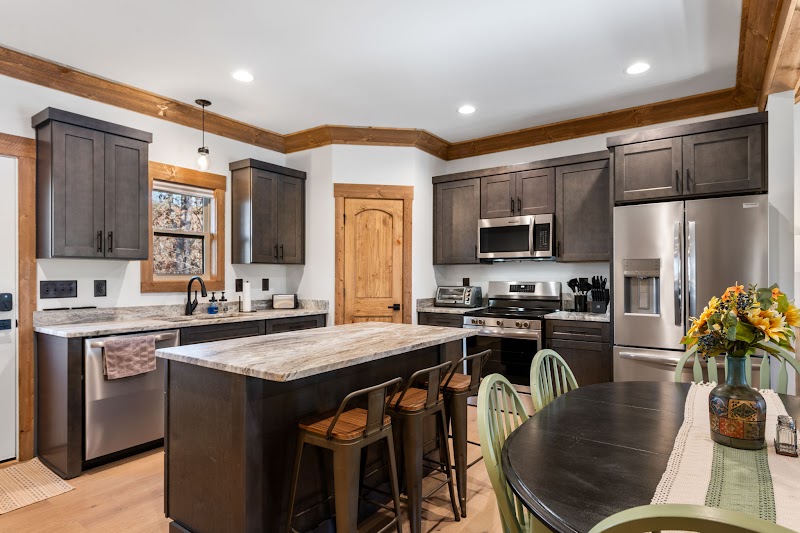 Chef's kitchen with island at Orchard & Vine Mountain Haus cabin in Ellijay Georgia