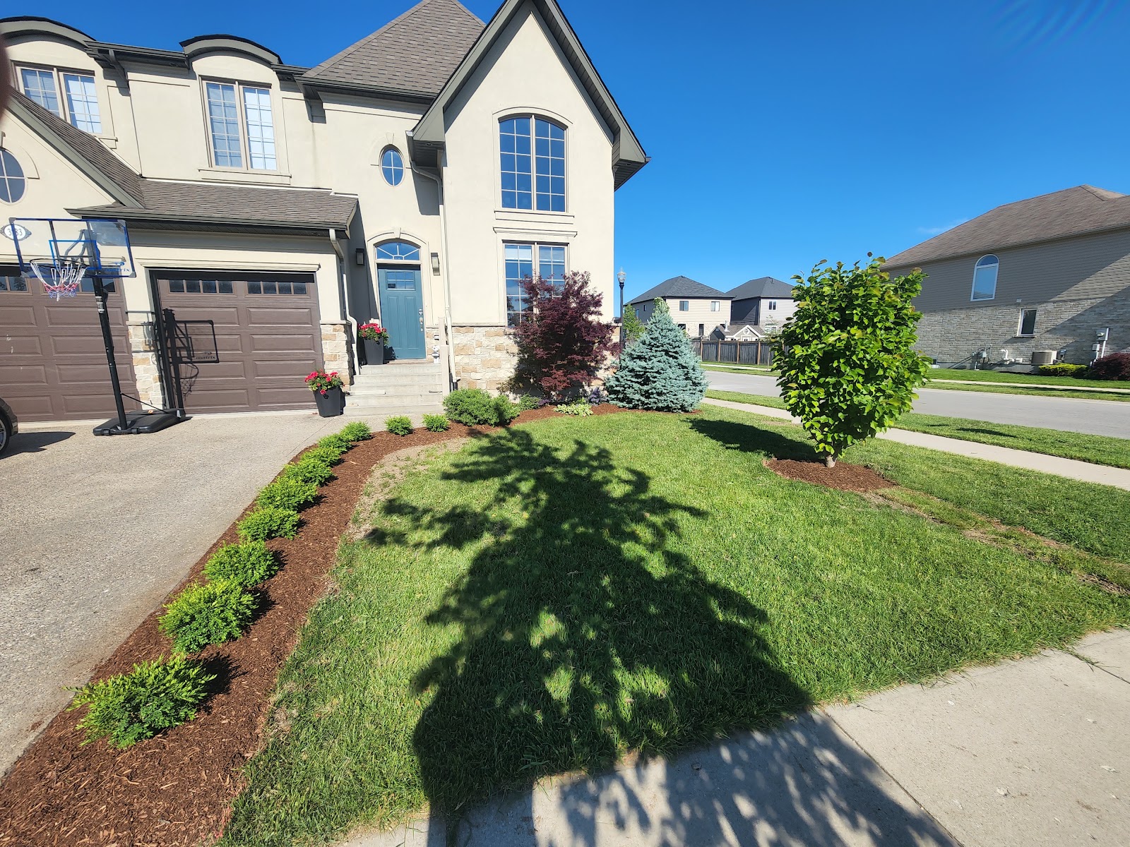 Front entrance flower garden landscaping in London, Ontario