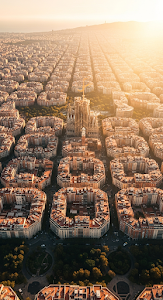Aerial View of Sagrada Familia in Barcelona's Eixample Grid at Golden Hour