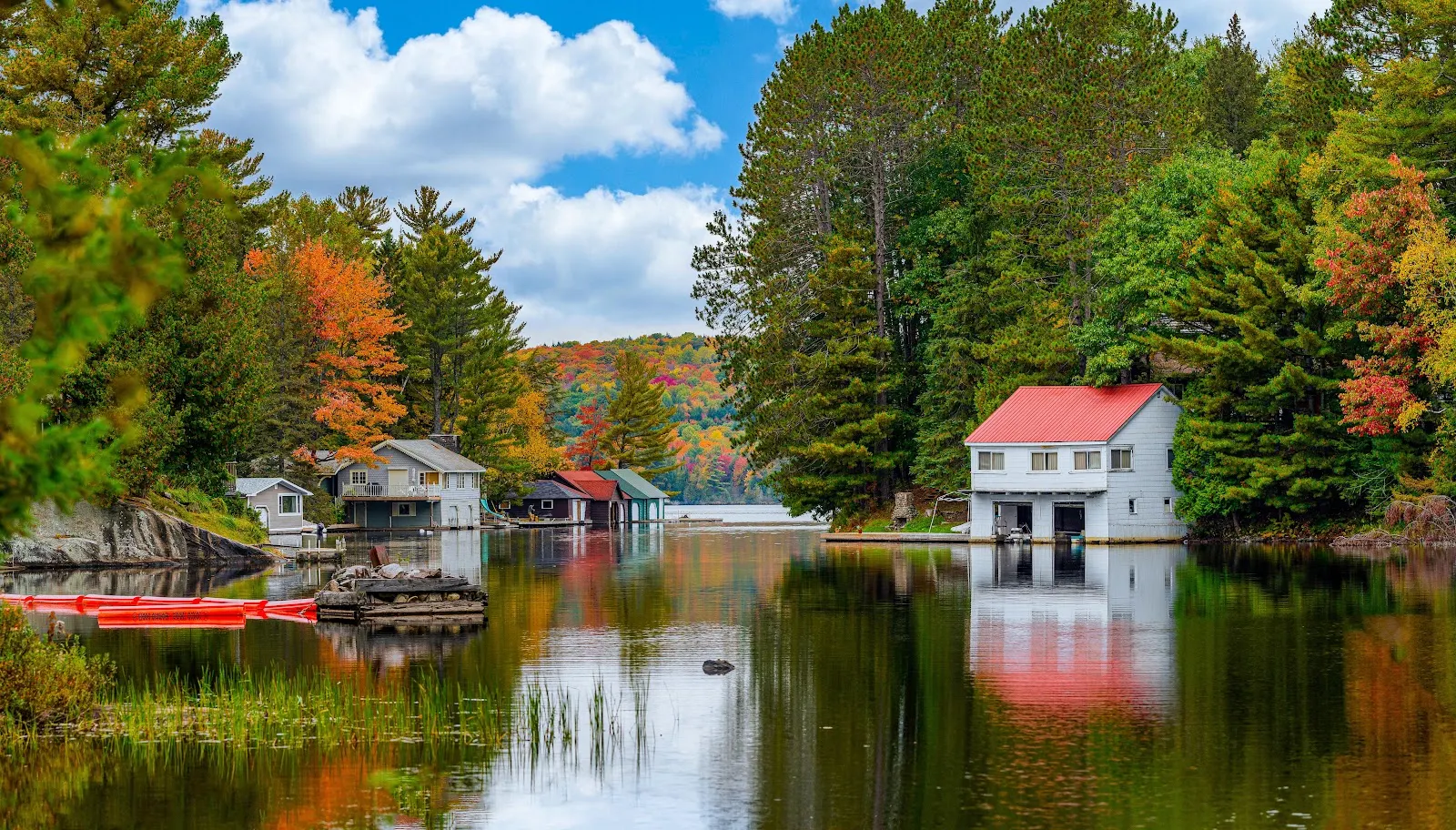 Lake Houses in Autumn Forest - Landscape Photography 5K Wallpaper (6144x3501)
