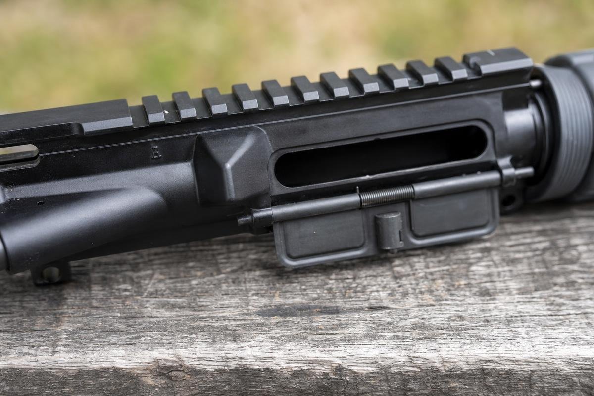 AR-15 dust cover vs forward assist and brass deflector components