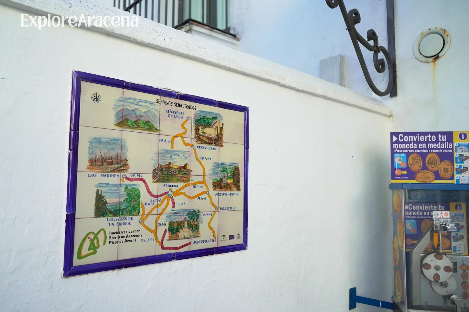 Painted ceramic map on a wall in Aracena showing local villages and walking trails through the Sierra.
