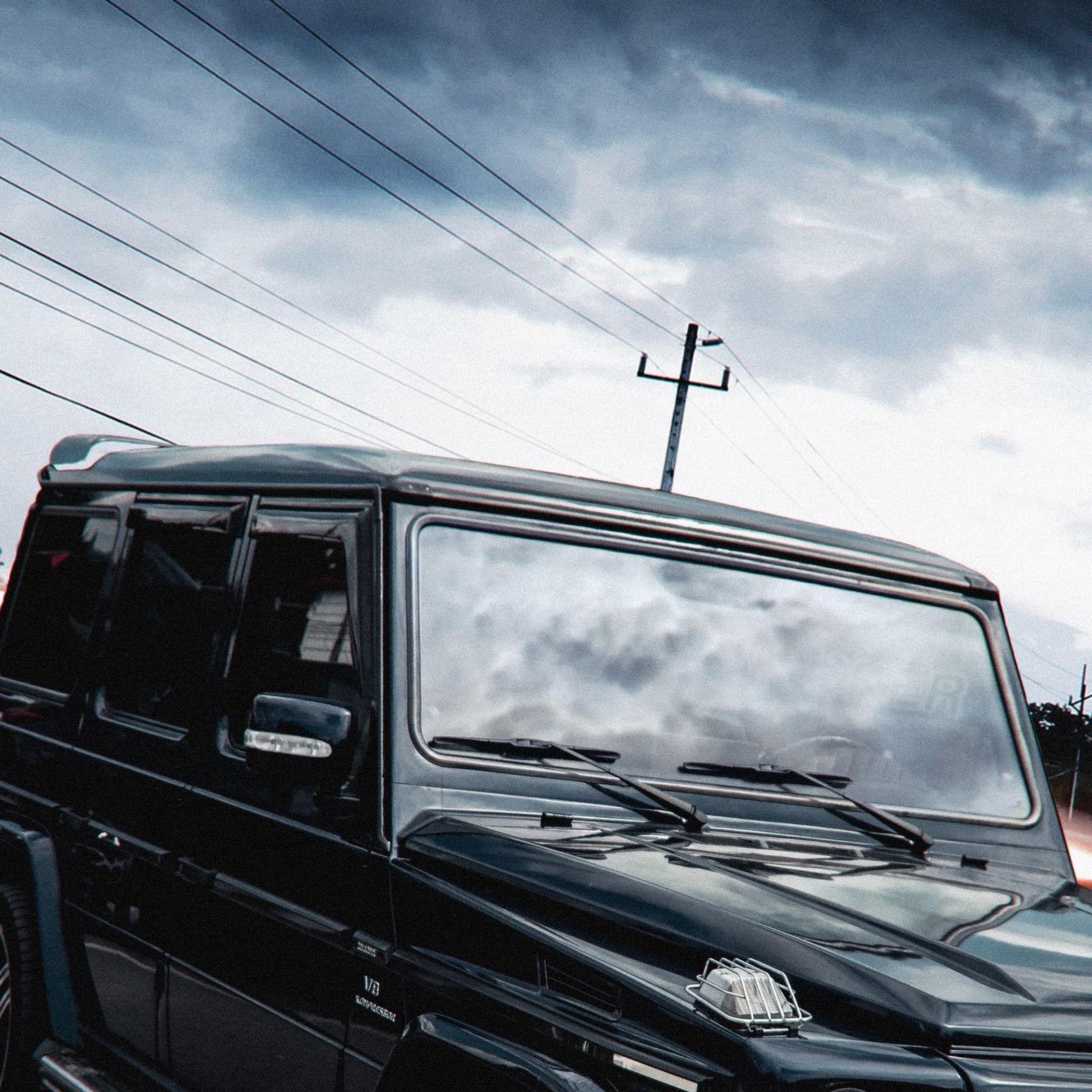 Download Mercedes G-Wagen Under Stormy Sky 2K iPhone