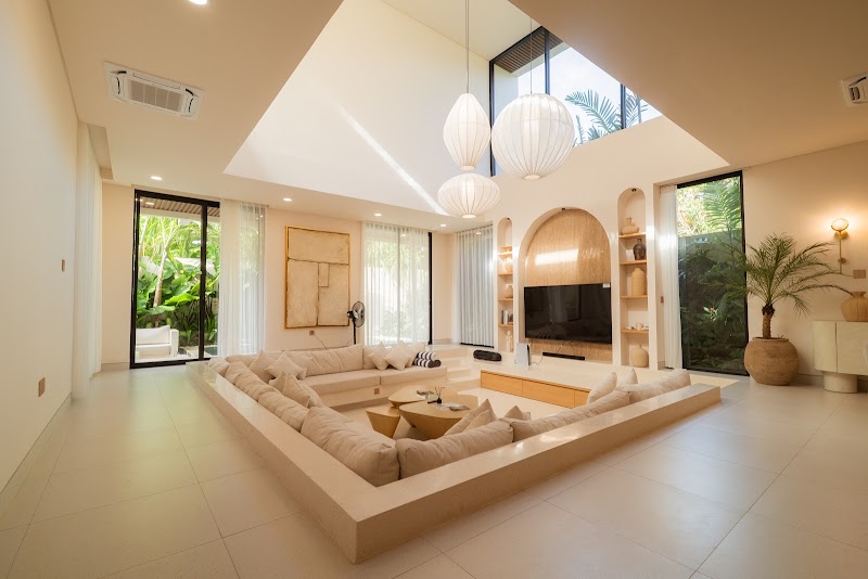 Seven metre sunken living room with arched alcove and pendant lights at La Calma