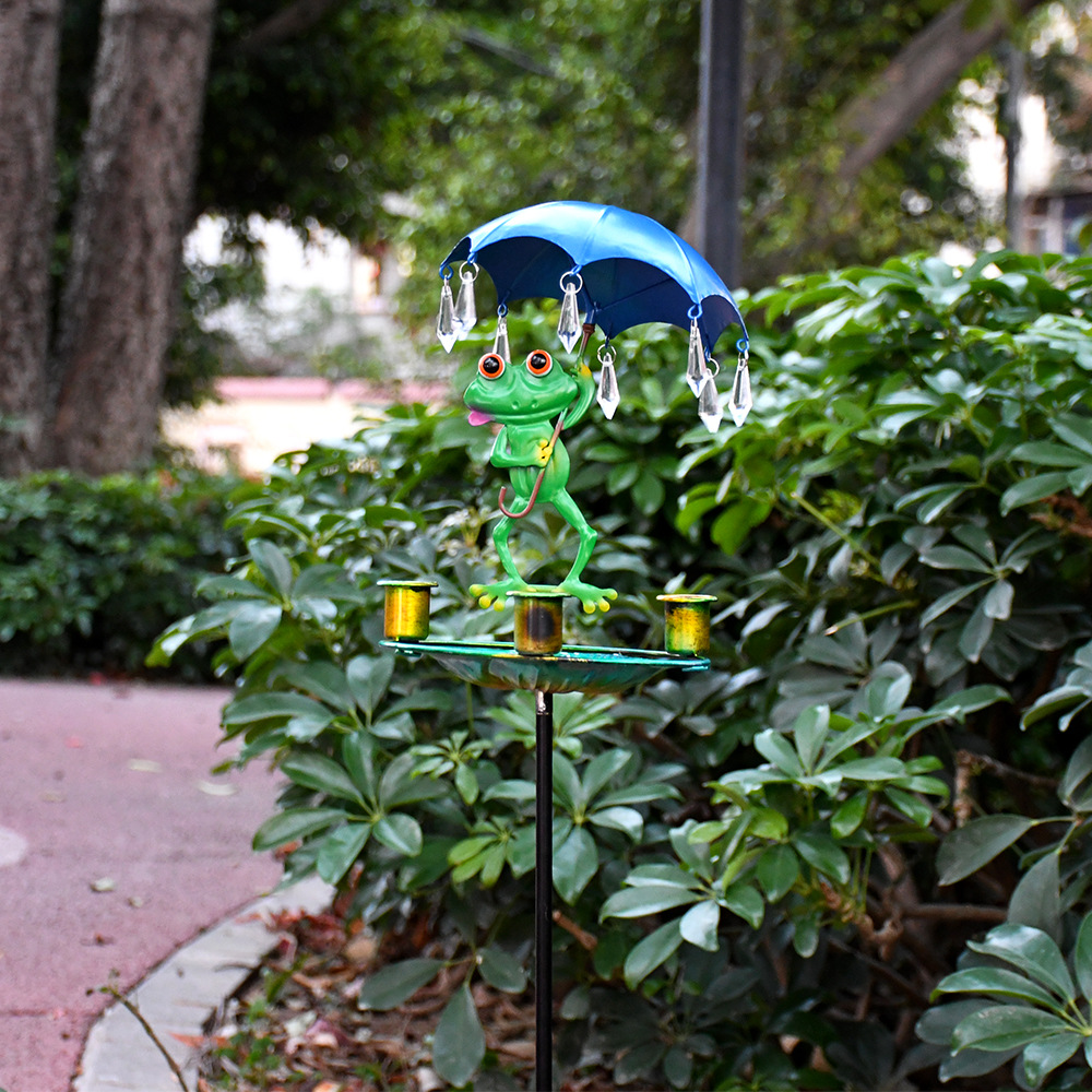 Decorative frog birdbath with iron umbrella