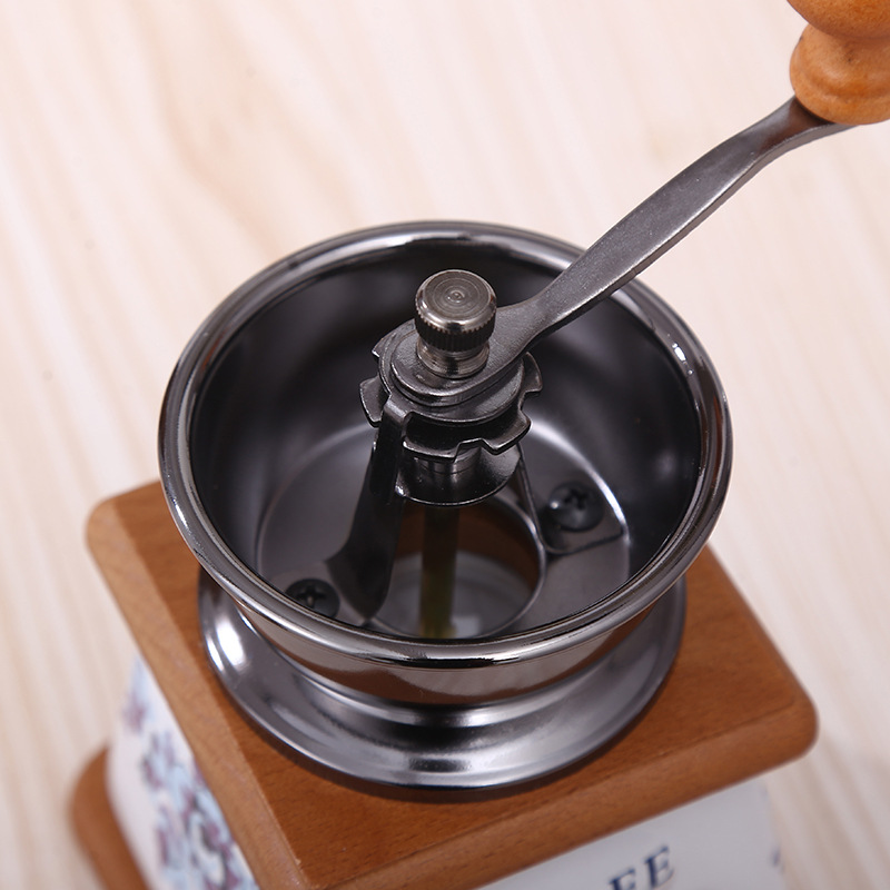 Hand coffee grinder with CNC grinding mechanism and brush