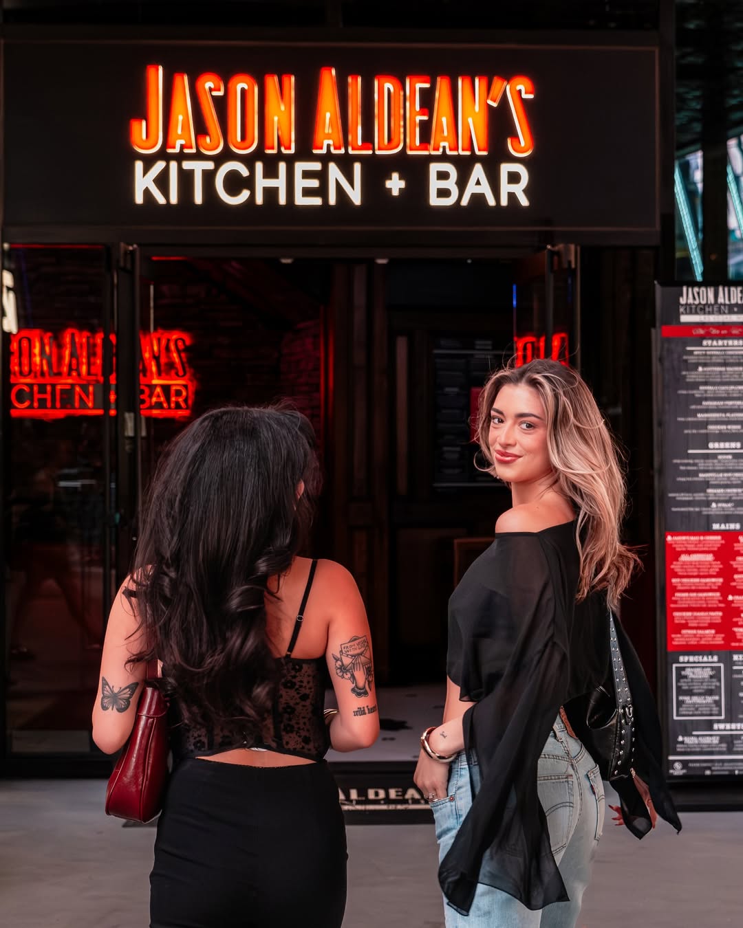 Exterior view of Jason Aldean's Kitchen + Rooftop Bar showcasing its vibrant Broadway location.