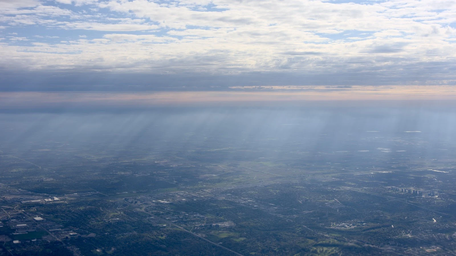 Sunbeams Over a Vast Landscape - Aerial Photography 5K Wallpaper (6016x3384)