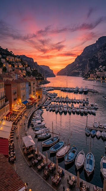Dusk Scene in a European Port Town with Boats and Waterfront Cafes - Free mobile Wallpaper