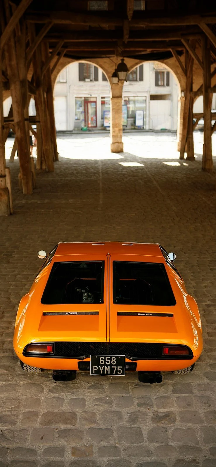Orange Lamborghini Under Wooden Archway - Automotive Photography iPhone Wallpaper (1017x2203)
