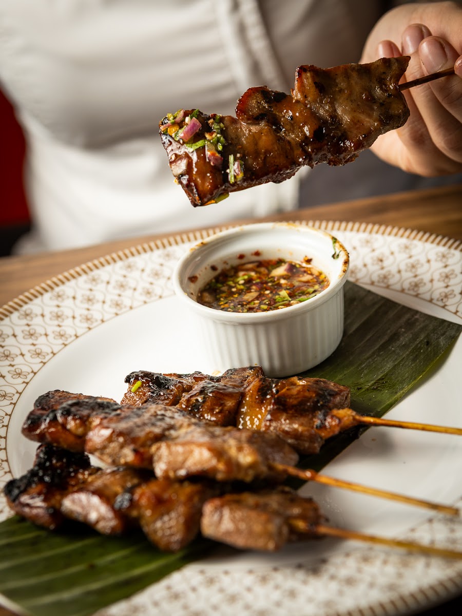 Moo Ping charcoal-grilled pork skewers with dipping sauce at Chaan Thai