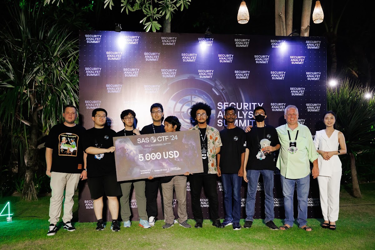 Project Sekai holding the 5,000 USD prize check at the Security Analyst Summit CTF 2024 finals in Bali