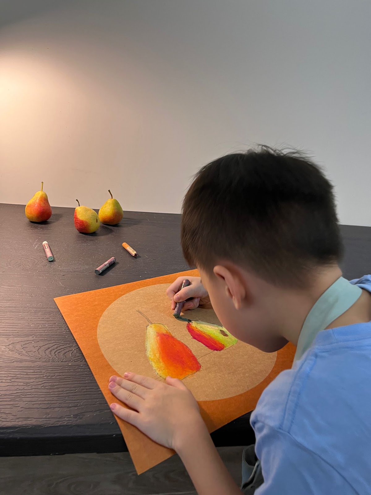 A student's art portfolio with various drawings and paintings.