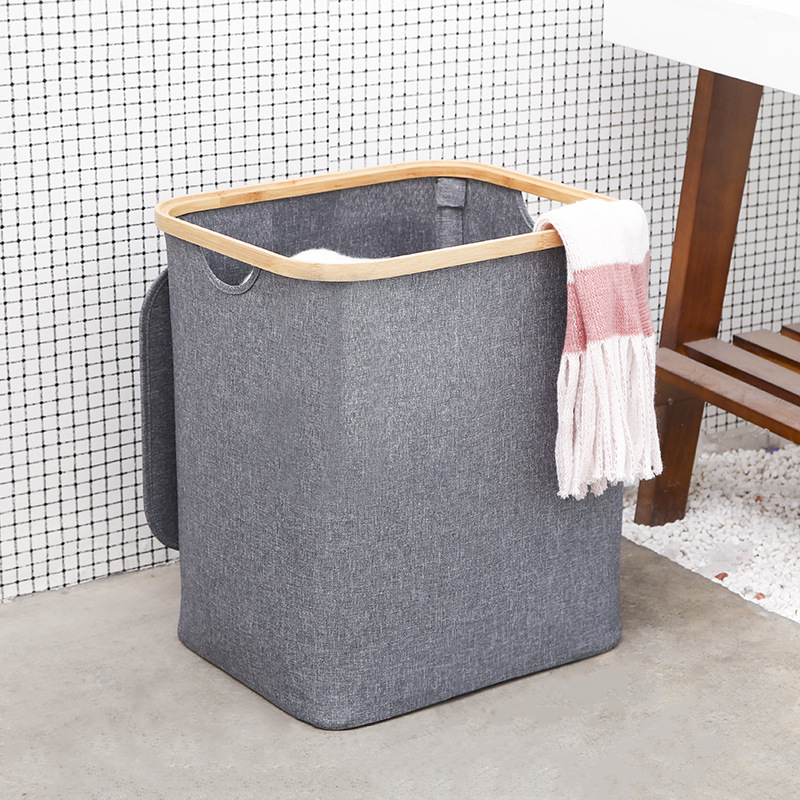 Foldable laundry basket made of bamboo and fabric
