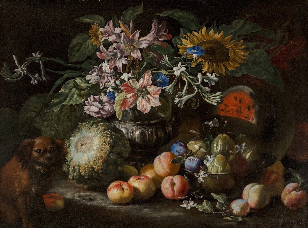 A still life of fruit and flowers in a footed gadrooned silver vase with a spani
