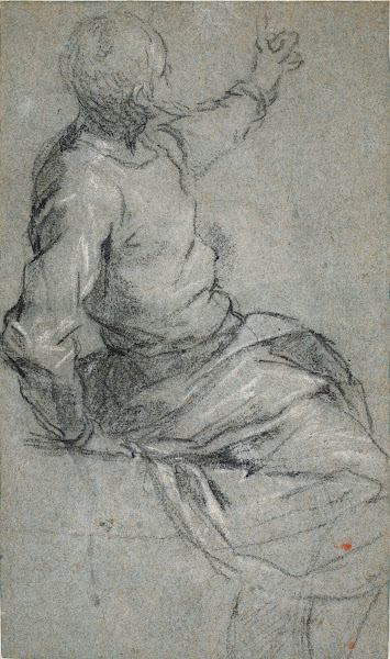 A bearded man seated his left arm raised