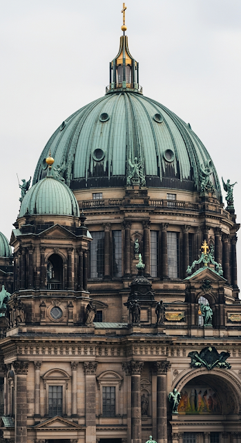 Detailed Close-up Photo of the Green Dome and Facade of a Grand European Cathedral - Free mobile Wallpaper